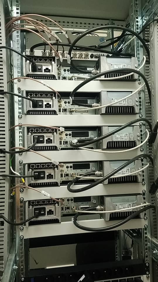 Network transmission equipment installed in an equipment rack with cabling